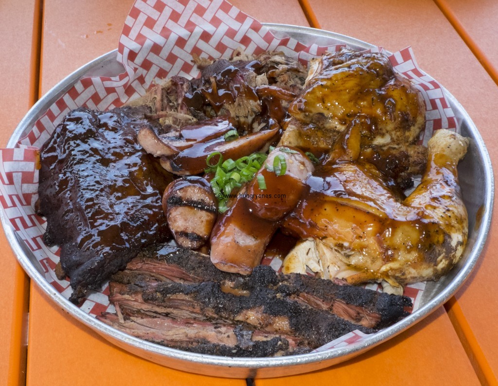 The sampler with pulled pork, sausage, bbq chicken, pork ribs, and brisket.