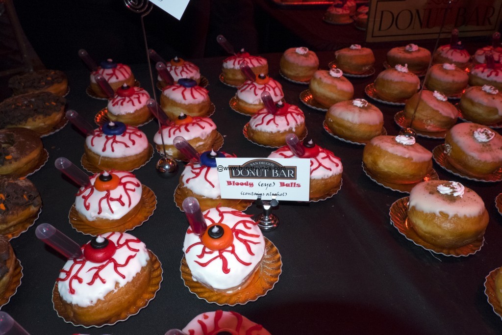 Raspberry filled alcoholic donuts. Pumpkin donut to the right. 