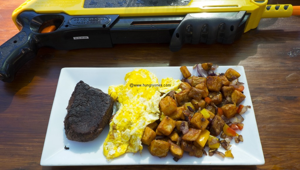 Steak, eggs, country potatoes. Salt gun in the back.