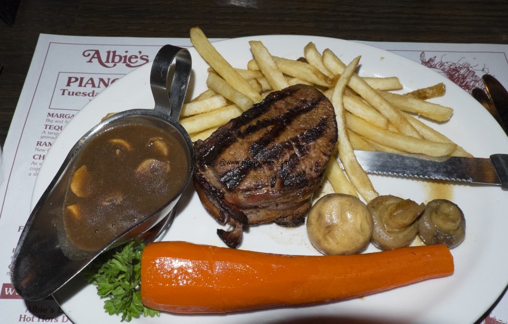 Bacon wrapped filet mignon with mushroom gravy.