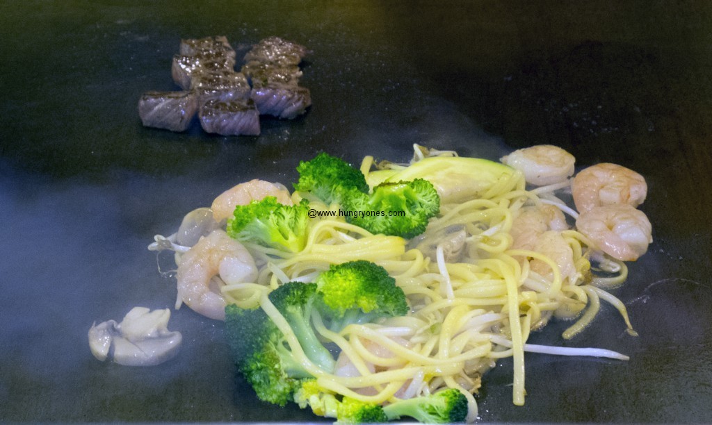Steak, shrimp, noodles, broccoli, mushroom, and bean sprouts.