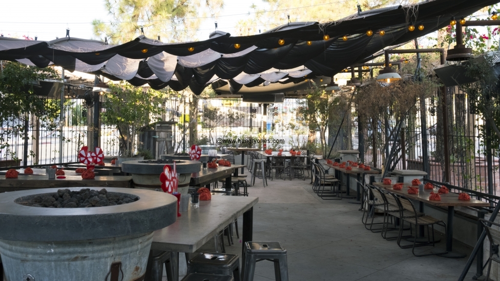 Outdoor dining area with Yelp swag.