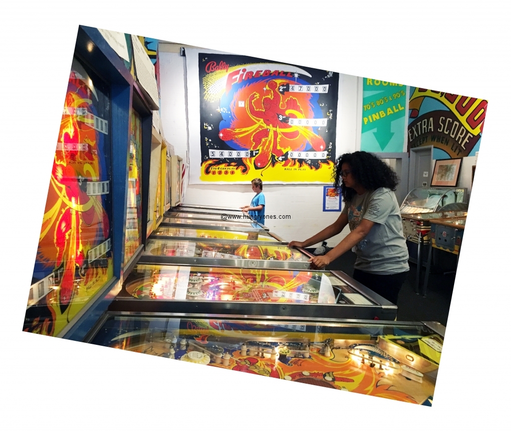 Mari playing pinball.